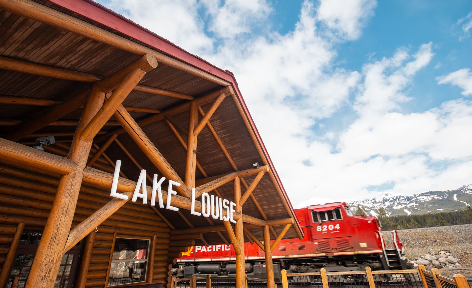 Historic train station restaurant in Lake Louise with mountain views and vintage railcar dining